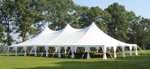 White tent with three peaks and gathered side curtains